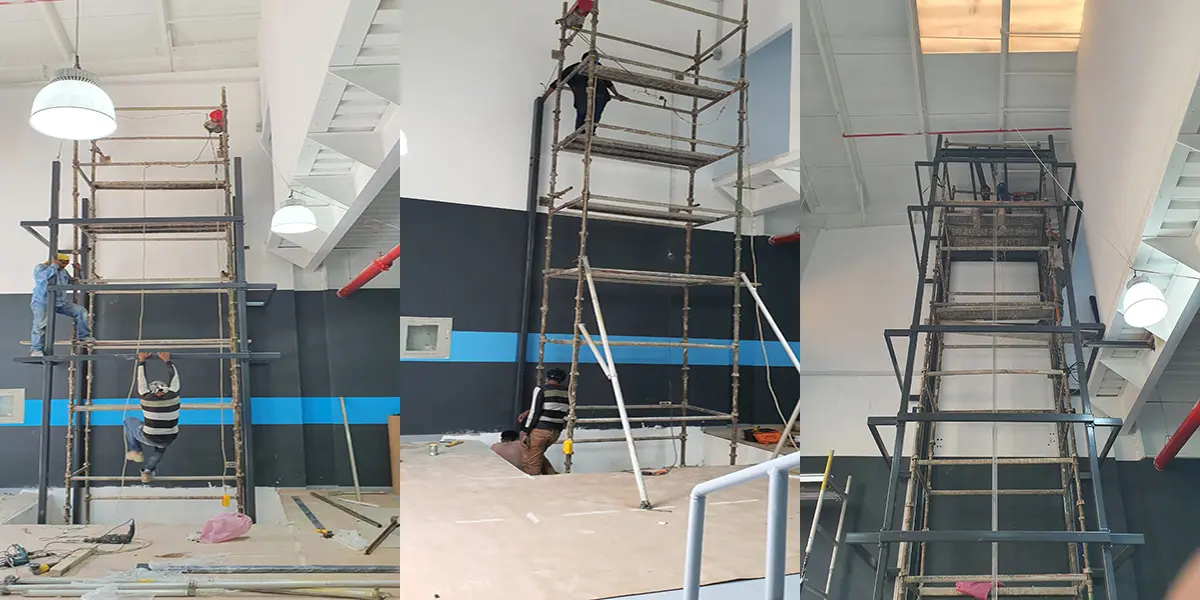 Glass-clad steel elevator shaft in atrium
